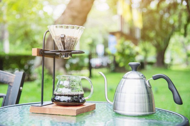 making-drip-coffee-vintage-coffee-shop-with-green-garden-nature_1150-14516.jpg